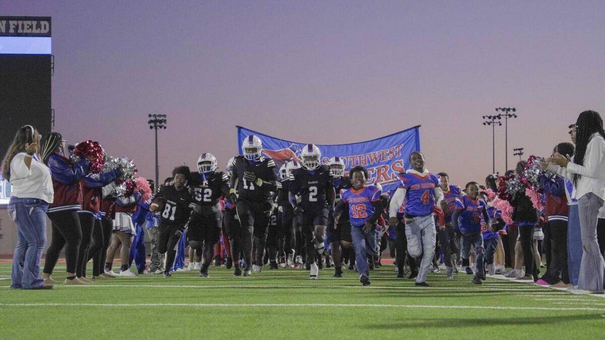 Fort Worth Southwest runs onto the field during a high school football game against Fort Worth Western Hills at Clark Stadium in Fort Worth, Texas, Thursday, October 30, 2025. Southwest won 40-6.